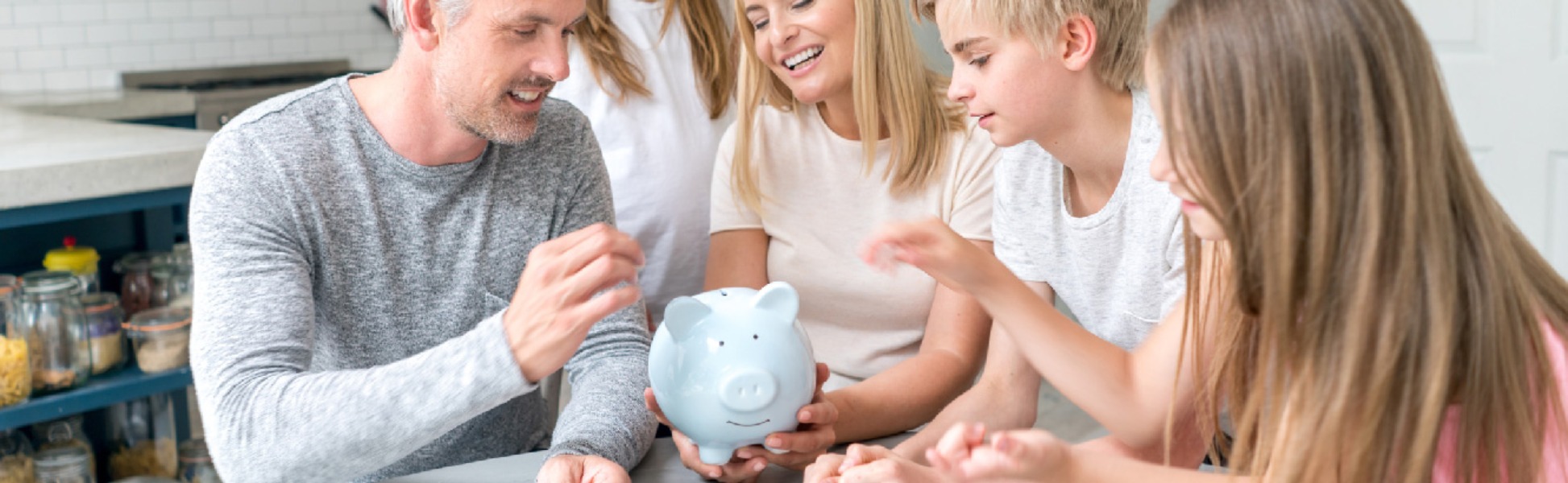 Family showing children the value of saving.